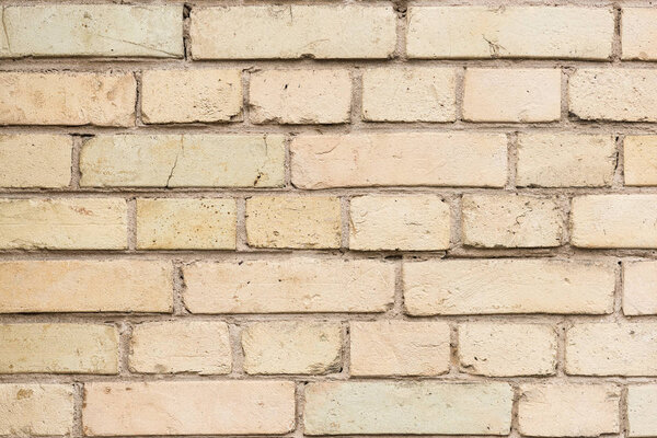 Old wall with broken bricks background