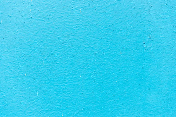 Old blue plaster on wall background