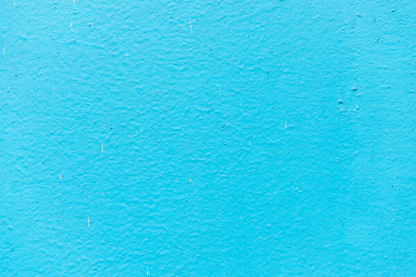 Старая синяя штукатурка на фоне стены
