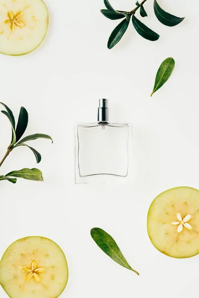 Top View Glass Bottle Perfume Surrounded Green Branches Apple Slices — Stock Photo, Image