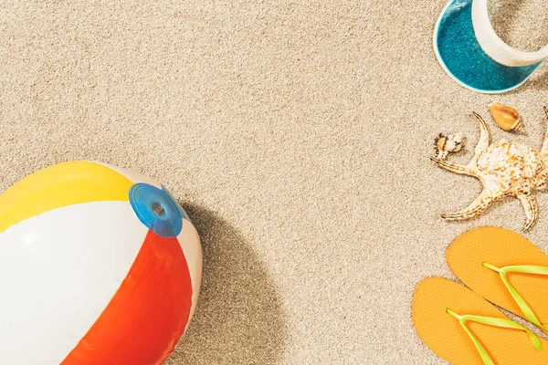 Top View Arrangement Colorful Beach Ball Flip Flops Cap Sand — Stock Photo, Image