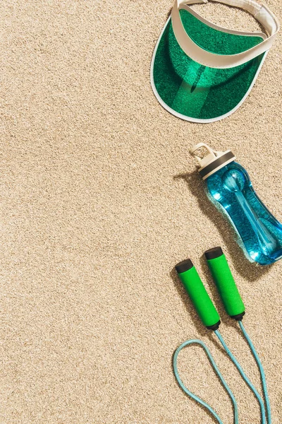 Top View Arranged Cap Water Bottle Jump Rope Sand — Free Stock Photo