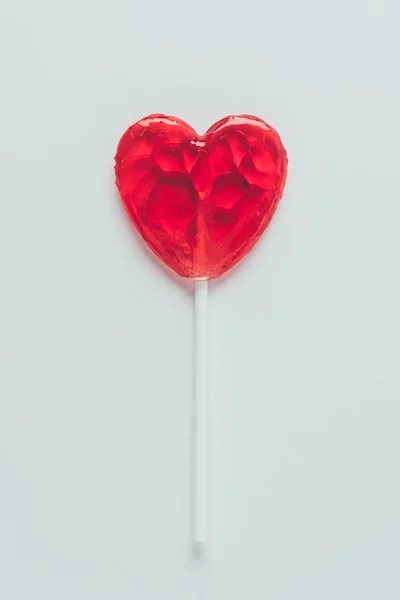 Top view of heart shaped lollipop isolated on white, valentines day concept — Stock Photo