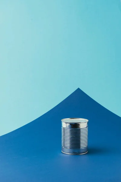 Close up view of metal can on blue background, recycle concept — Stock Photo