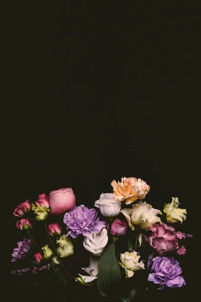 Beautiful tender fresh blooming flowers isolated on black — Stock Photo