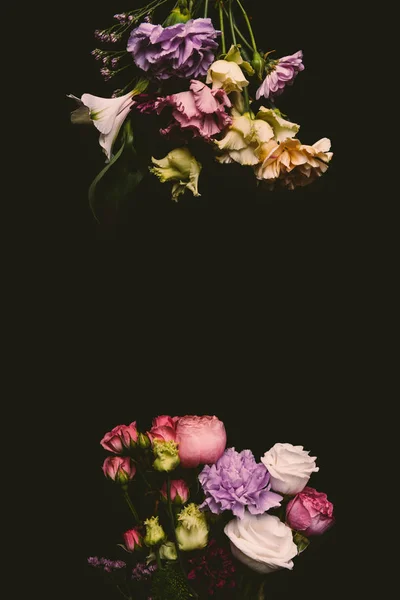 Composition of beautiful tender fresh blooming flowers isolated on black — Stock Photo