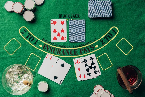 Gambling concept with cards and chips on casino table — Stock Photo