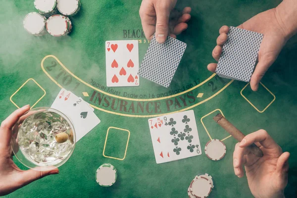Smoke over people playing black jack by casino table with cards and chips — Stock Photo