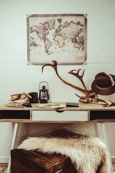 Close up view of table with map, magnifying glasses and various decorations — Stock Photo