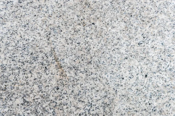 Detailed texture of light granite wall — Stock Photo