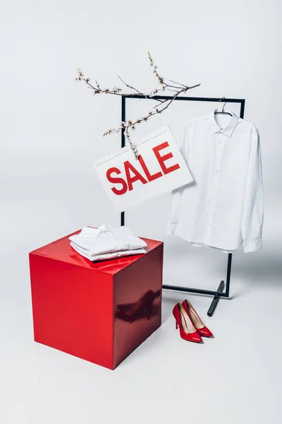 Cube, red high heels, shirt on hanger and sale sign, summer sale concept — Stock Photo