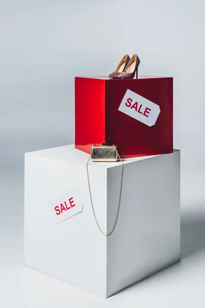 Handbag, high heels and sale signs, summer sale concept — Stock Photo