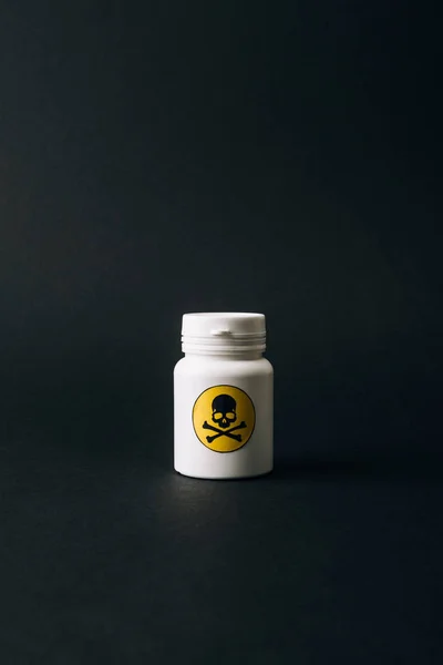 Jar with skeleton sign isolated on black — Stock Photo