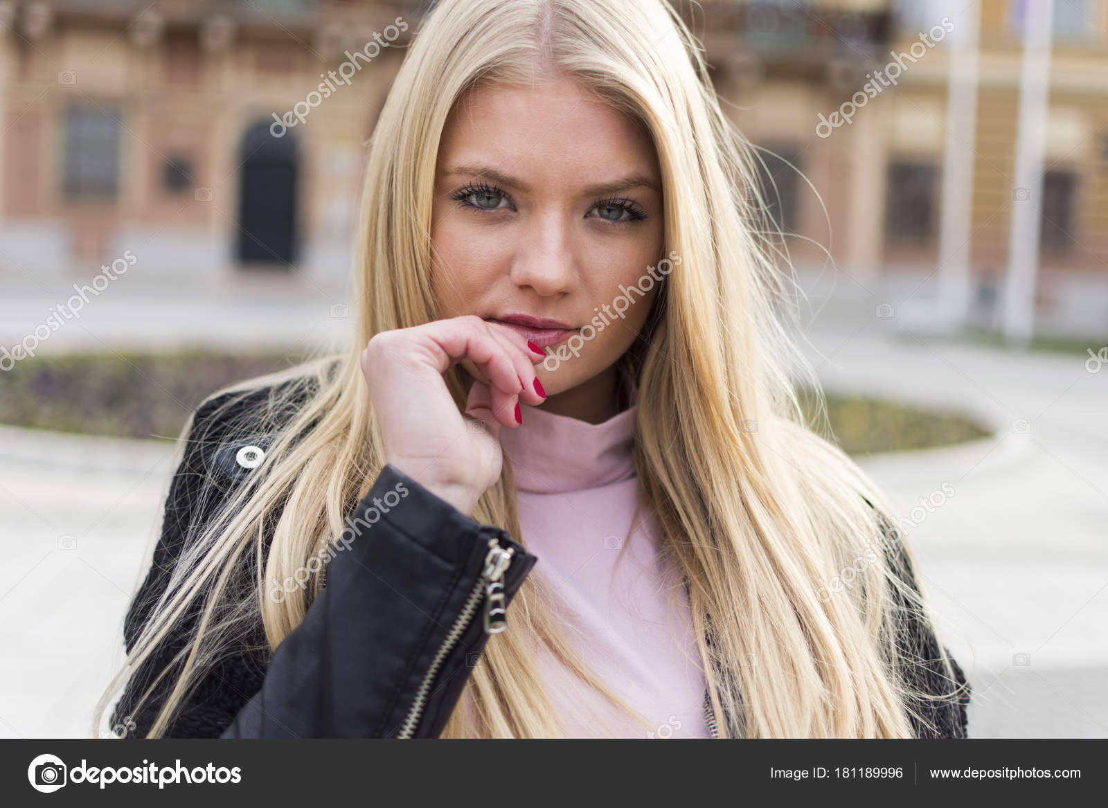 Young And Attractive Girl With Long Blond Hair And Blue Eyes