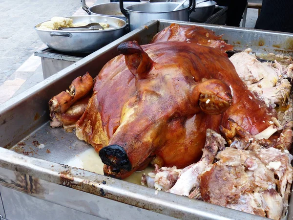 Chanco hornado or roasted pig at the opened market in Cuenca. Street food. Traditional ecuadorian and Latin American food.