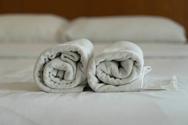 White towel set and bed in modern hotel