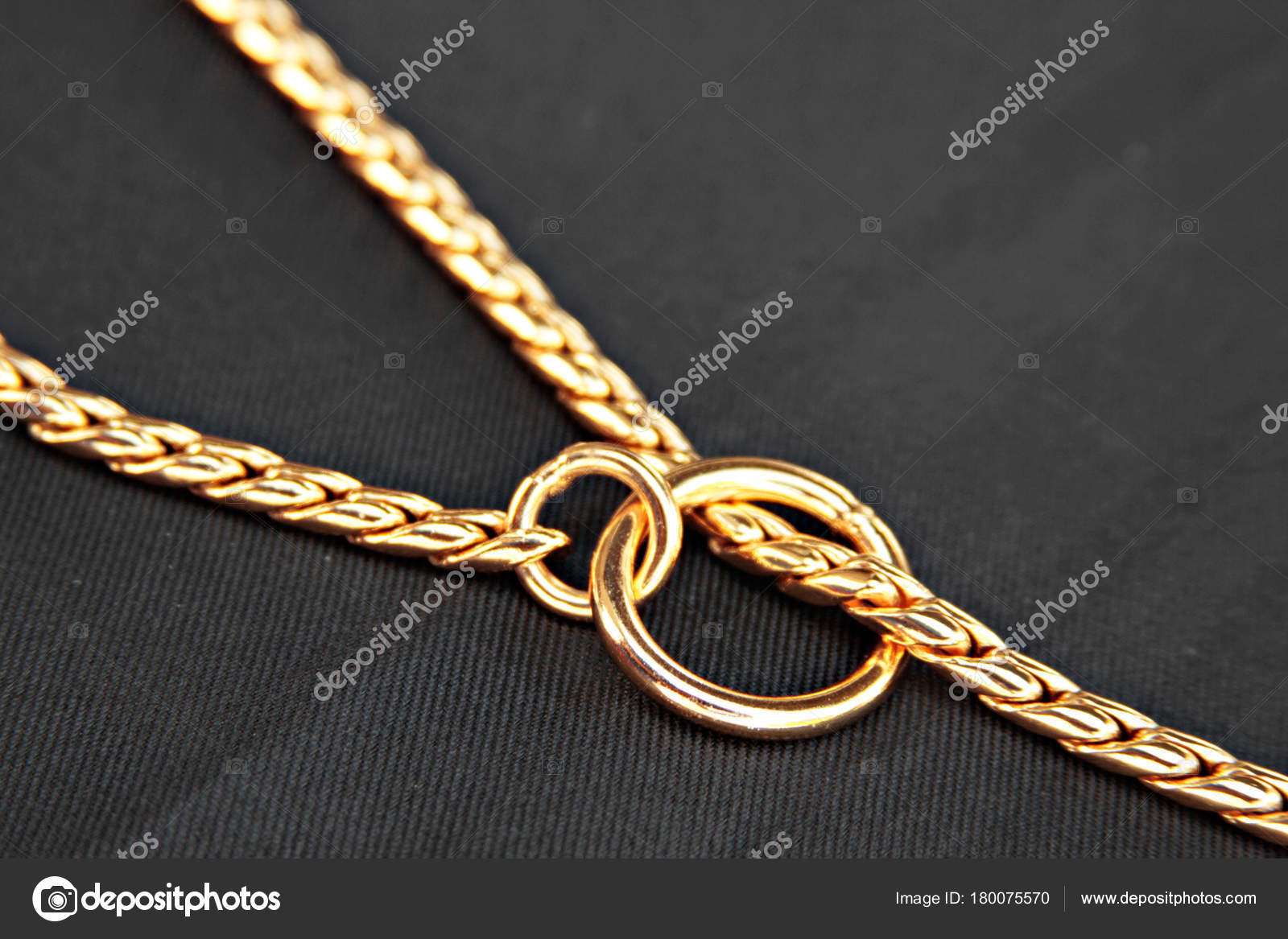 Gold choke chain for dog isolated on black background Stock Photo