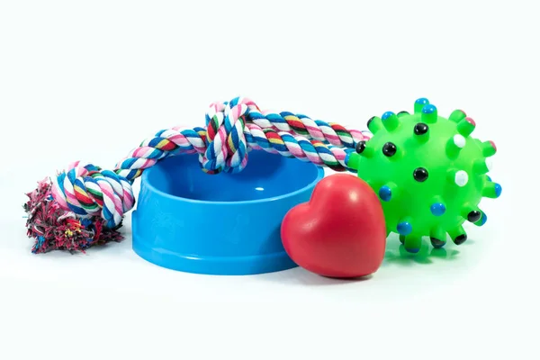 Pets are friends concept.  Pet bowl and rubber toys with rope — Stock Photo, Image