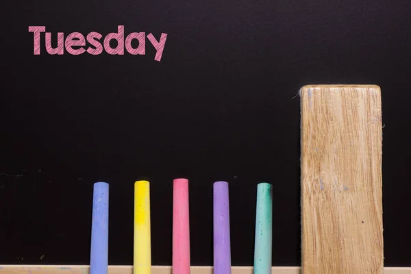 Tuesday on Blackboard with chalk and eraser — Stock Photo, Image