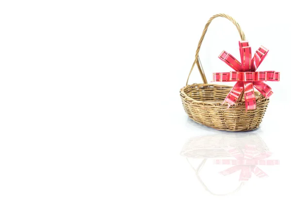 Empty wicker basket with red and gold ribbon isolated — Stock Photo, Image