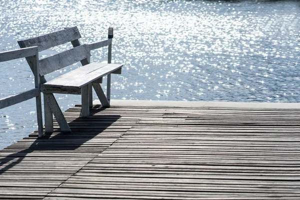 stock image Wooden chairs and pond for relax time at home