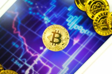 Hisse senedi grafik arka planı ile Bitcoin.