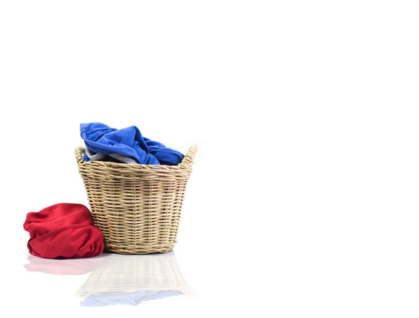 Clothes in a laundry wooden basket isolated on white — Stock Photo, Image