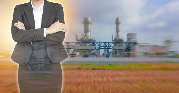 Business woman on Power Plant background