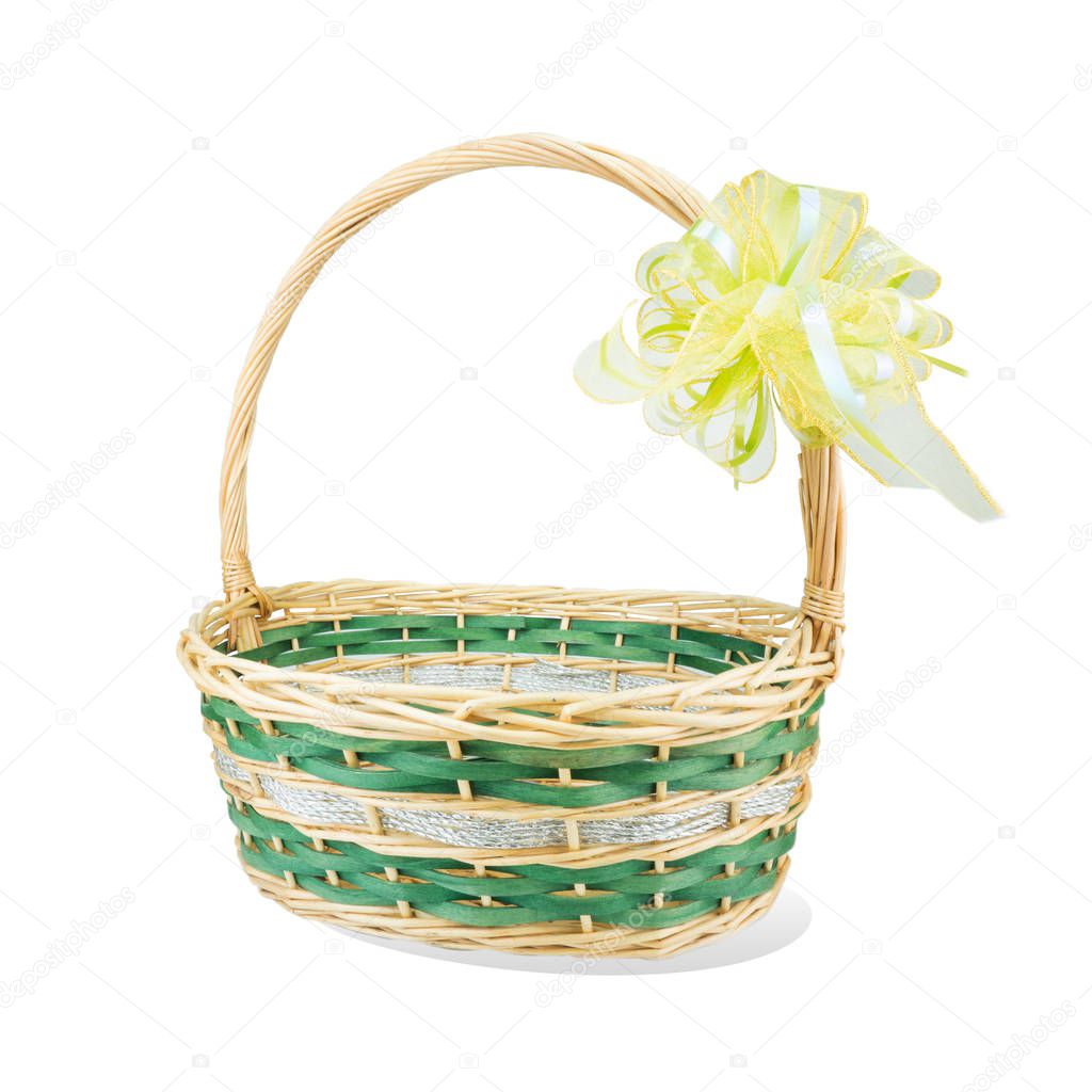 Empty wicker basket with ribbon isolated on white background