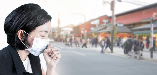 Woman wearing health masks on blur group people background