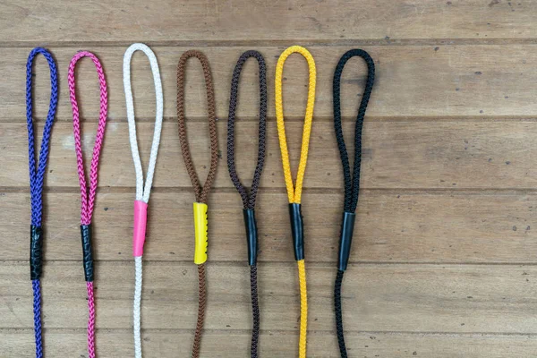 Pet leashes on wooden background.  Pet accessories concept