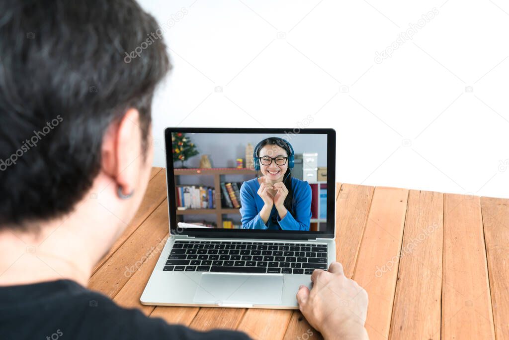 Couple using laptop for video chatting .  Remote communication concept