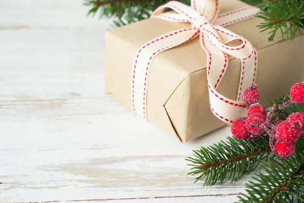 Christmas gift on white wooden table. — Stock Photo, Image