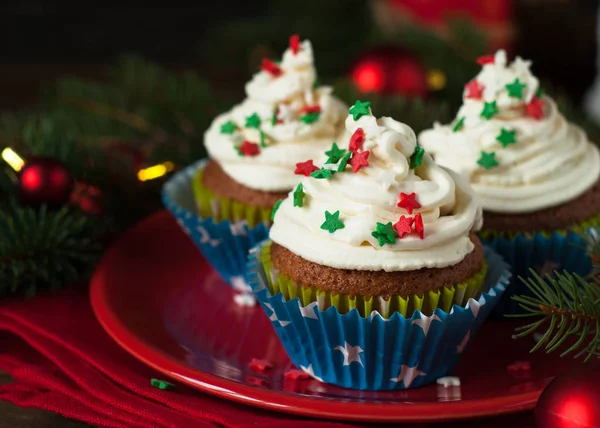 Christmas cupcakes with whipped cream — Stock Photo, Image