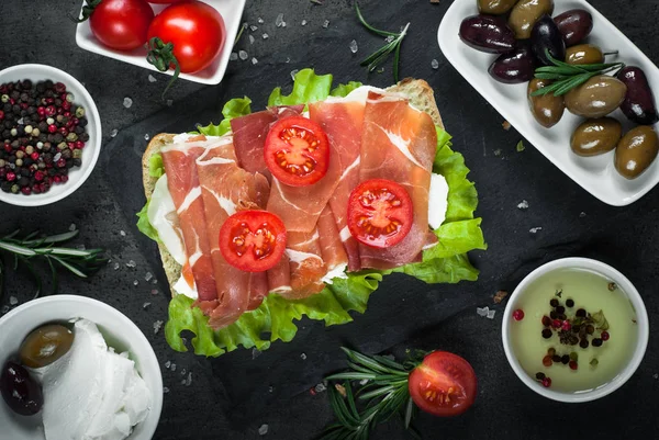 Ciabatta sandwich with  salad leaves jamon serrano mozzarella — Stock Photo, Image