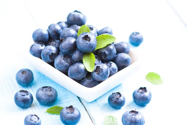 Fresh blueberriaes in white plate — Stock Photo, Image