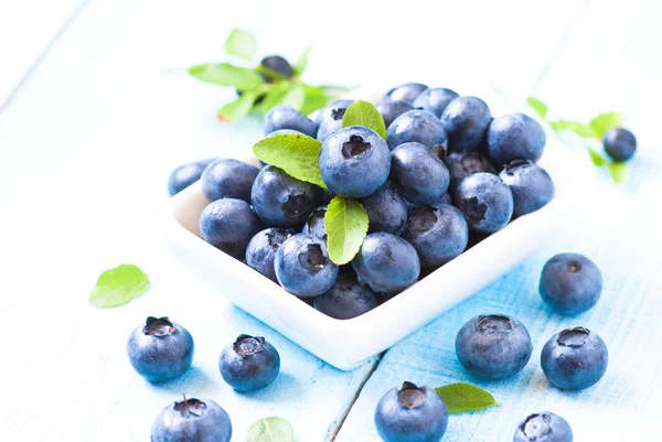 Fresh blueberriaes in white plate — Stock Photo, Image