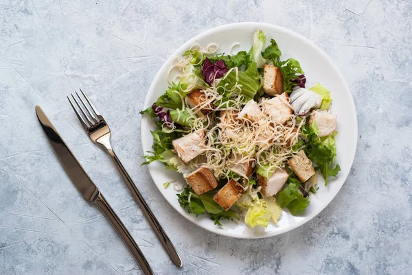 Caesar salad in white plate — Stock Photo, Image