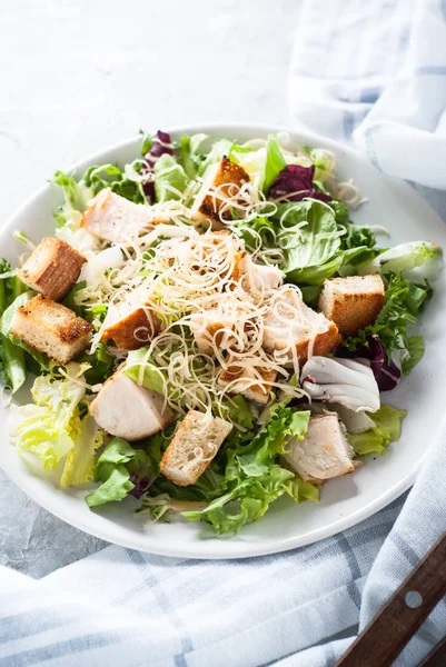 Caesar salad in white plate — Stock Photo, Image