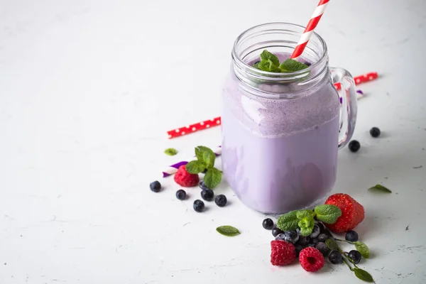 Berry milkshake on white. — Stock Photo, Image