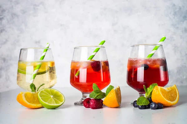 White, pink and red sangria with fruit