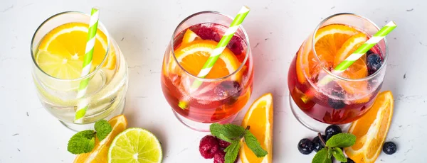 White, pink and red sangria with fruit — Stock Photo, Image