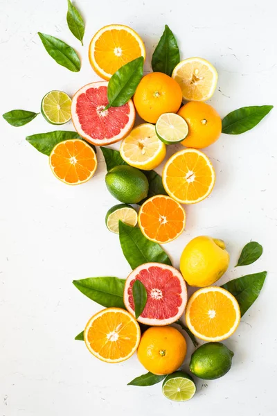 Fresh citrus fruit assortment on white. — Stock Photo, Image