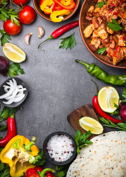 Cooking Mexican taco with meat beans and vegetables.