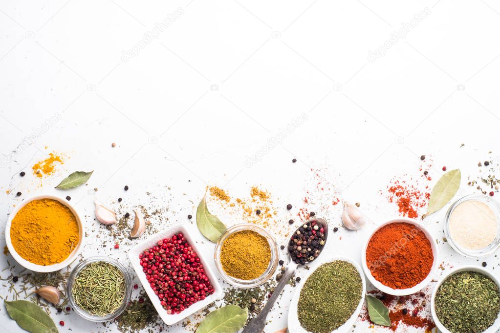 Various spices in a bowls on stone table. 