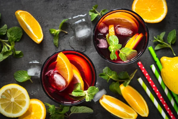 Sangria with fruit mint and ice on black slate. — Stock Photo, Image