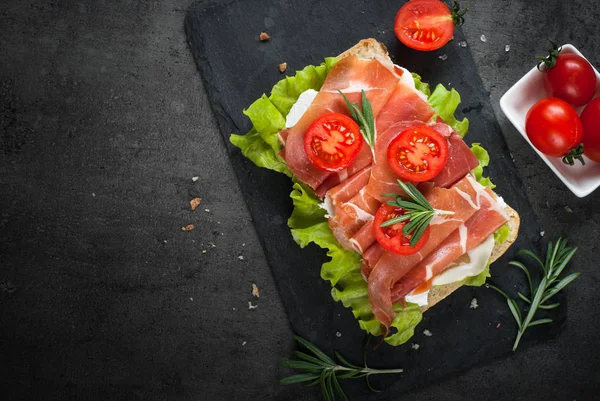 Ciabatta sandwich with  salad leaves jamon serrano mozzarella on — Stock Photo, Image
