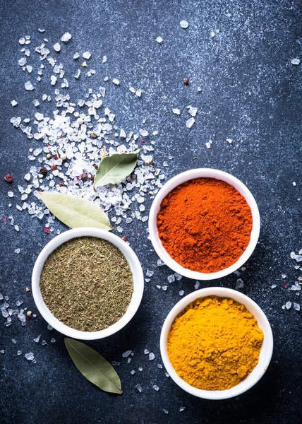 Various spices in a bowls on stone table. — Stock Photo, Image