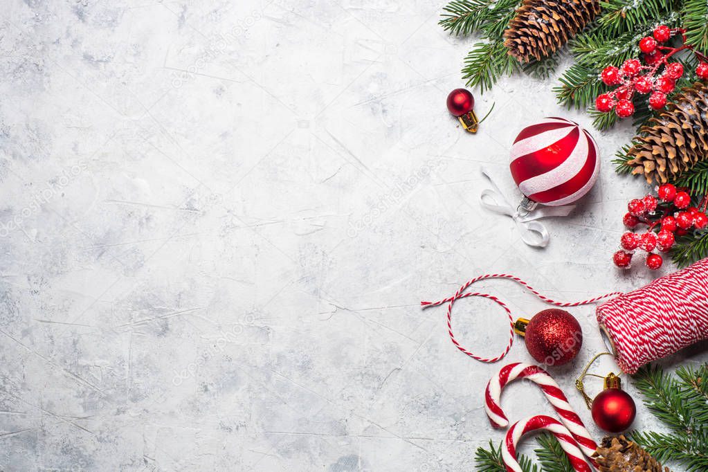 Red christmas present box, fir tree branch and decorations. 