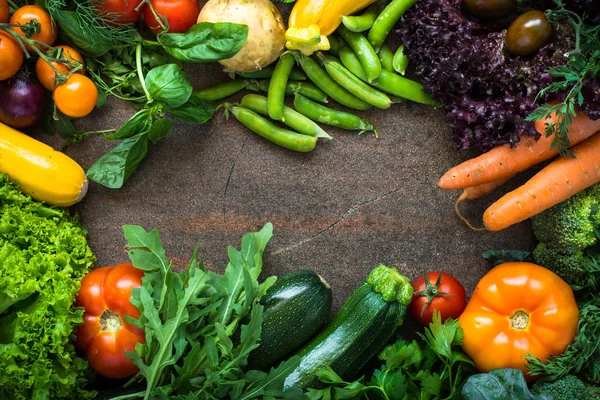 Organic farmer vegetables on dark slate table. — Stock Photo, Image